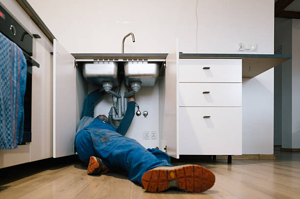 Professional Plumbing technician working in Ely, IA